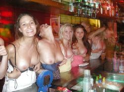 College girls at the bar flashing their boobies