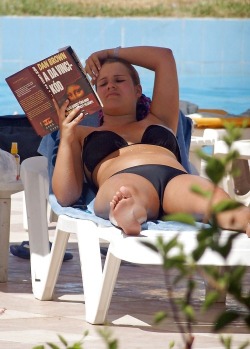 Kicking back reading and rocking a hot camel toe