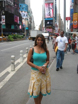 Posing in NYC with her pokies showing