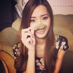 Cute Asian Stoner Girl Smelling Some Bud
