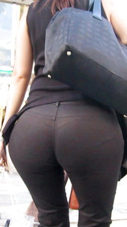 Round booty with thong panty lines showing through black pants