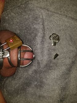 Sissy Cuts Chastity Key in Half