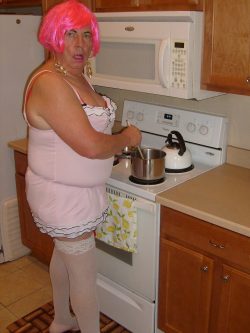 Sissy maid prepares food