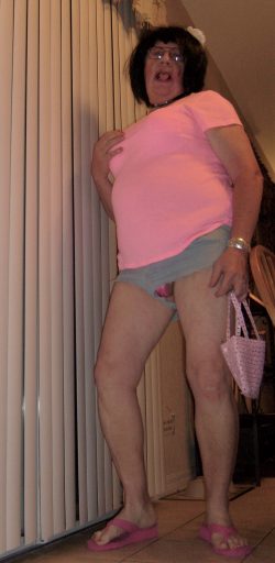 Sissy looking cute in his short shorts and carrying his pink purse