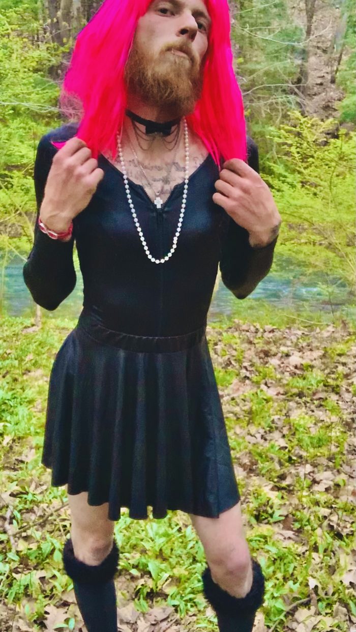 Mandi playing dress up in the woods.