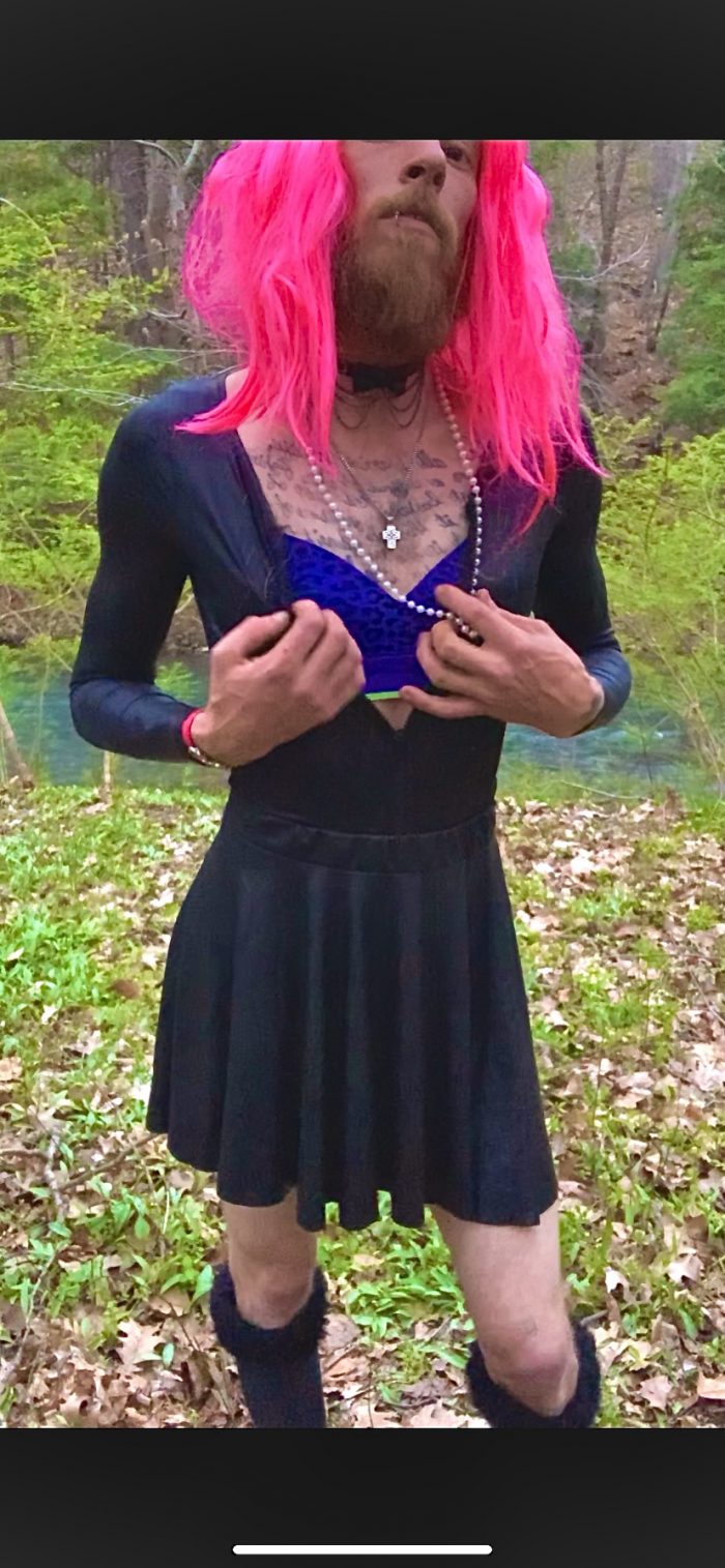 Mandi playing dress up in the woods.