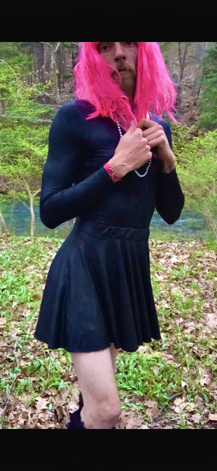 Mandi playing dress up in the woods.