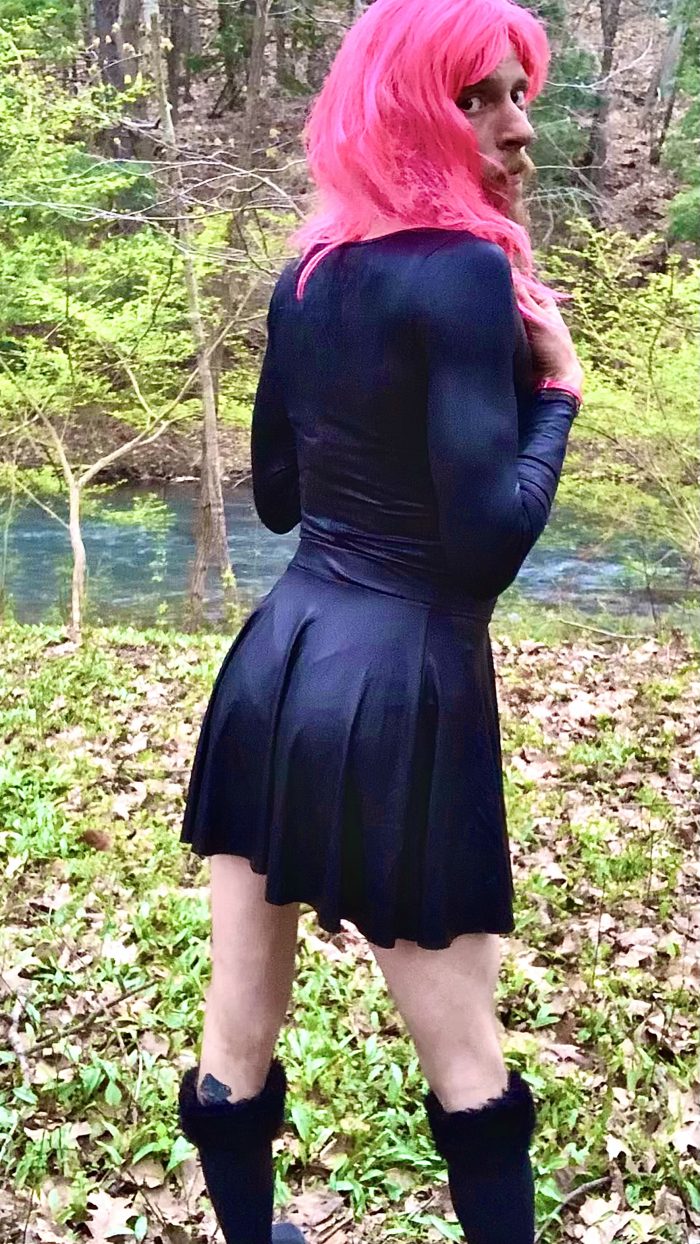 Mandi playing dress up in the woods.