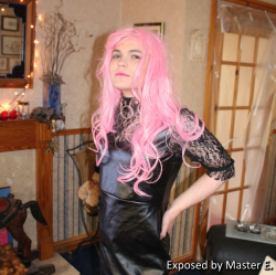 Sissy Dee Summers in a black leather dress