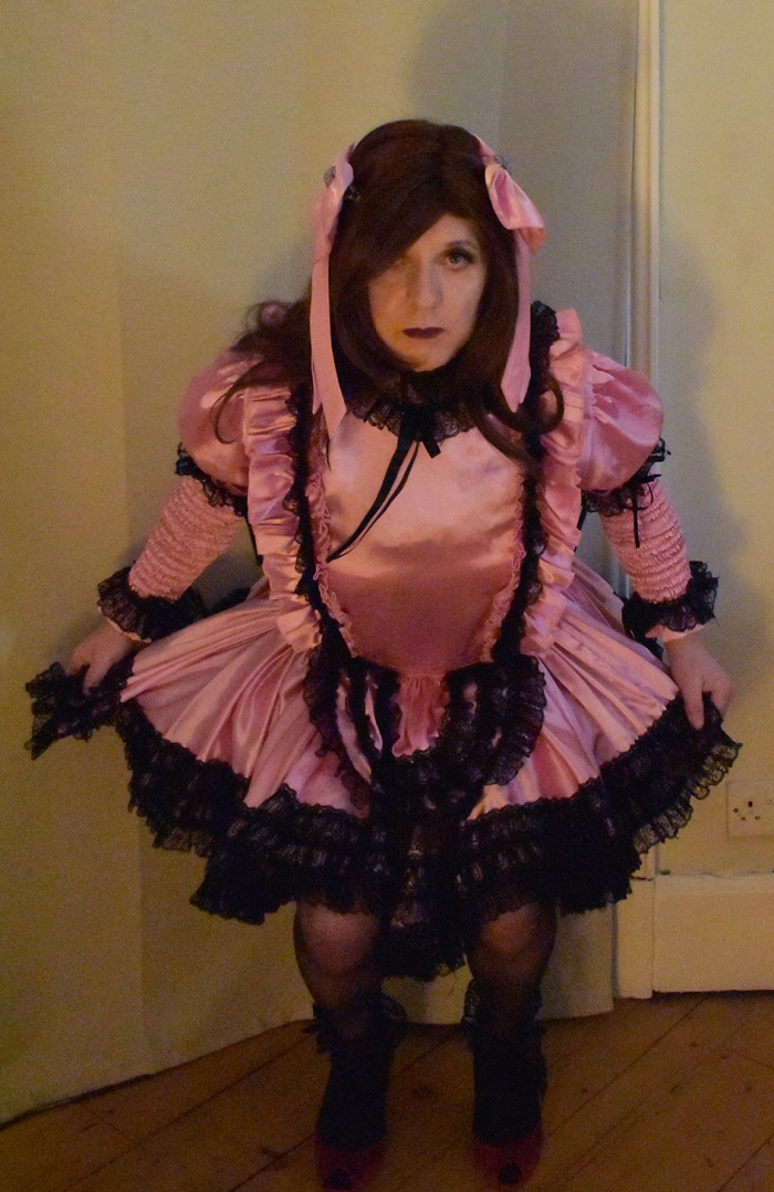 Dressed as a satin sissy maid and humiliated. Made to curtsey and laughed at