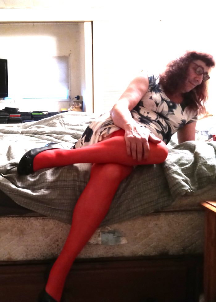 On my bed in red stockings