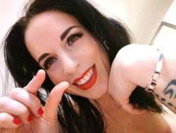 Mistress flashes the tiny dick sign during a dick rating