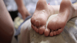 Feet sprayed with hot cum